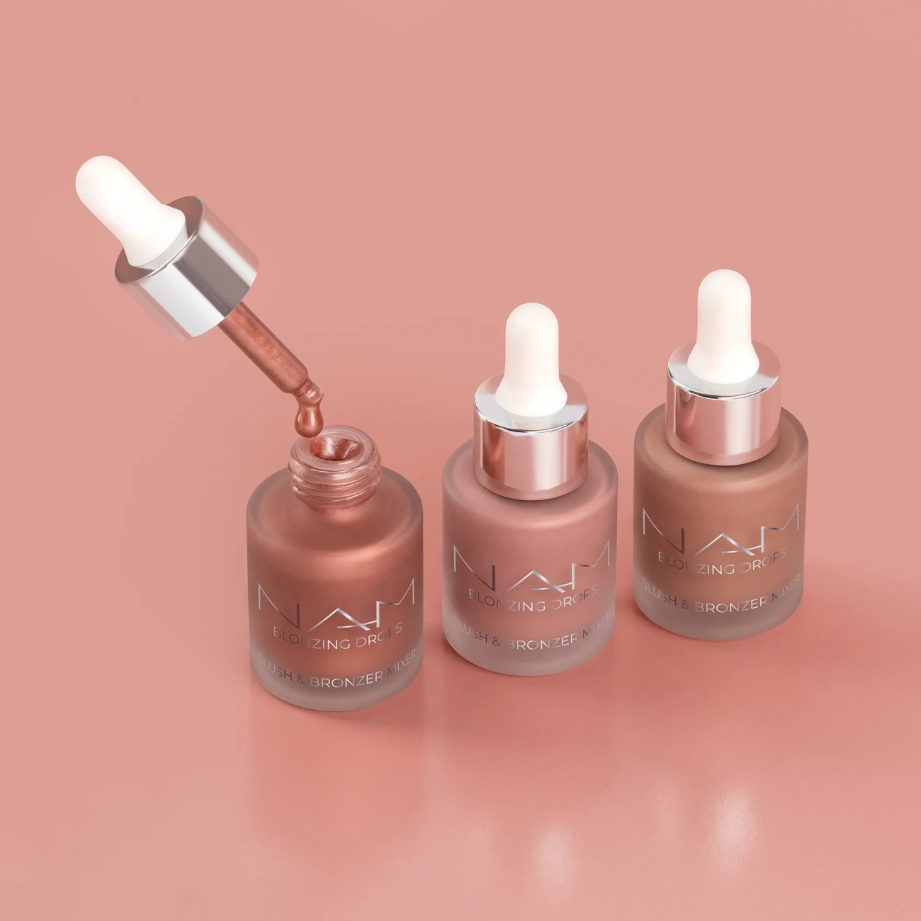 NAM Rozświetlający bronzer-r&oacute;ż w płynie  Blonzing Drops